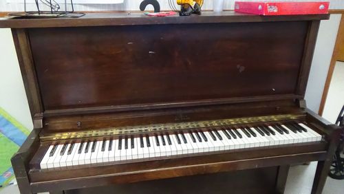 This is a 1932 P.S. Wick Co. piano. Wick folded up for good about a year later, in early 1934. They were out of St. Paul and began production in 1890.