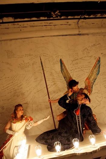 Christopher Cartmill's production of Lope de Vega's ACTING IS BELIEVING (LO FINGIDO VERDADERO) Apoth Set by Zach Sitrin, lights by Vici Chirumbolo and costumes by Mary Kutch. Pictured "the Apotheosis of Genesius" with Kristin Kittel (Death), Mitch Bultman (Genesius) and Brandon Flynn (Michael) (photo by Allegra Heart)