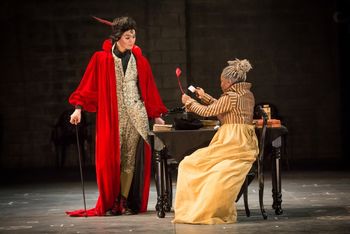 Christopher Cartmill's production of Goethe's Faust — The Bargain Goethe's FAUST directed by Christopher Cartmill, set design by Bo Ra Kwan, costumes by Sarah Zinn and lighting design by Catherine Cusick — pictured Mephistopheles (Timothy Bright) and Faust (Candace Taylor) photo by Matt Pilsner