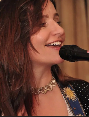 Clara Bellino singing at an event