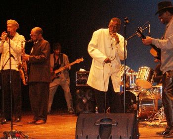 ChasWVStateLarrysing320101 Larry sings at WV State U concert 2010 with Bob Redd and Dugan Carter, horns; CC Copeland bass; Killer Ray Allison guitar