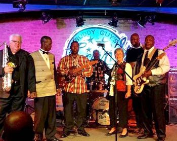 TaylorBandBuddyGuys_2014_11_n1 Larry Taylor with a family band, Buddy Guys Legends Nov. 2014: Mike Finnerty sax, Larry Taylor, Eddie Taylor guitar, Tim Taylor drums, Barrelhouse Bonni, Kennie Pickens, Mark Harris