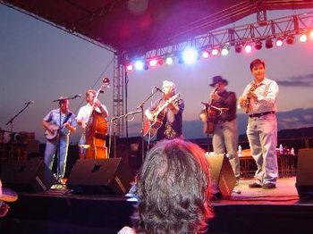 Lynn Beckman (Center) On Stage With Ronnie Reno & The Reno Tradition. (l to r) Mike Scott, banjo; Heath Van Winkle, upright bass; Lynn; Ronnie Reno, guitar; John Maberry, mandolin; Jackie Miller (not