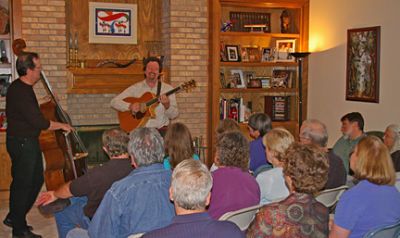 A group of thoroughly entertained friends and neighbors at a house concert near Denver CO. This concert came together only 2 weeks in advance, and the hosts were the talk of the neighborhood for the uniquely wonderful experience they provided. Andrew is joined here by Sean Kelly on upright bass.