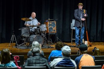 Me_and_Studio_Stu_at_HVCC_Lego_Drum_Set_Informance_taken_by_Vincent_Giordano 1 of 3 Duet performance with the incomparable Studio Stu: Studivarious (tub bass) & vocal during my Informance highlighting my Lego Drum Set at Hudson Valley Community College