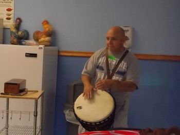 Me with Djembe and Micheal Thiele's Slit Drum At the Center for Disabilities at Smith Center rehearsing for their upcoming performance with the Ellen Sinopoli Dance Company 2 of 3