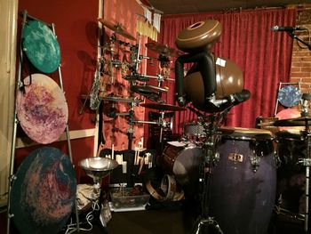 Photo 2 of An Evening with a Percussionist A view from stage right of some of the instruments I presented and performed on: Paper Drums, Rack of Textures, Frame Drums, Lego Drum Kit, Udu, Congas, Cajon, Boombakini, Slit Drum, Agogo Cluster etc. etc.