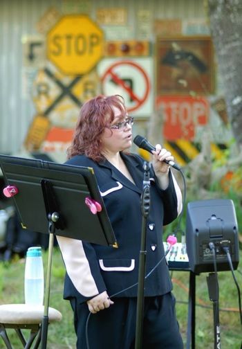 The hazard of doing an outdoor gig is that my hair is tousled. But both the clients and guests were happy, and the guys and I had fun. Overall, a very good day!