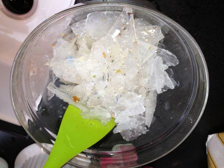 Bowl of dirty ice from freezer cleaning