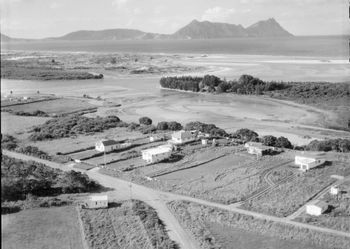 Ruakaka (Northland)...summer of '54 no camping ground yet....or road down to the beach.... which currently is cut through between the 2 houses on the right!!