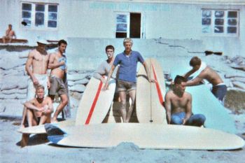 in front of the old Waipu Cove surfclub ...1963 Ross...?....Kit Steer....Roddy....Max....Tui...?..........some saturday nights you would walk into that clubhouse and there would be 20 or 30 people asleep on the floor in their sleeping bags...Ha!!