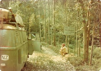 Paula sitting under the equator sign in the country of Rwanda... We could see the mountain in the distance where the Silverback Gorillas lived ('gorillas in the mist'...remember that story)...5 years later mass genocide here..500,000 people killed...