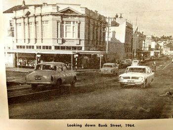 Downtown sleepy old Whangarei 1964.... even a guy on a pushbike in the middle of the road....guarantee he wasnt wearing a helmet then....no such law in '64.......in fact there was no seatbelts, and we would always pile at least 6 in a car...3 across the front seat...remember!!