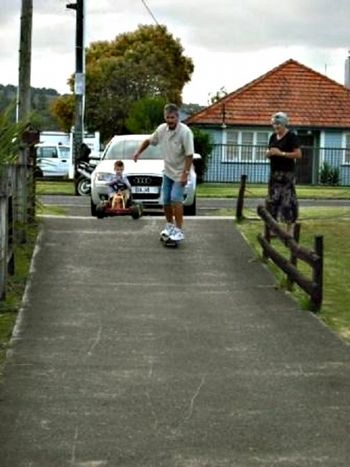 and so Trevor King has a go too.... only difference being...that this is nearly 50 years later.....same driveway...with sister Pat looking ...whom, i am told jumped on the skateboard herself.....silly old people!! Ha!!