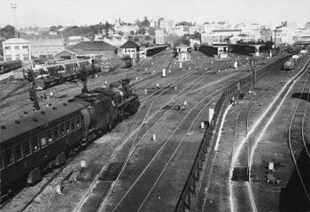 Looking southwest across the railway yards showing the Auckland Railway Station centre, an awesome steam locomotive 1950