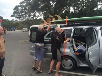 now, isn't this a classic photo................. couple of 'groms' tying their boards on after a good session in the surf...75 yr olds!! Don and Ross Edge....Waipu 2014...awesome!!!!