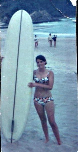 Pauline with a new ..nice looking Atlas Woods..Matapouri 1968 Notice that boards were getting shorter and more maneuverable looking....interestingly the widest part of the board was nearer the back, which helped for higher performance, but made it a lot looser than what we were used to!!..