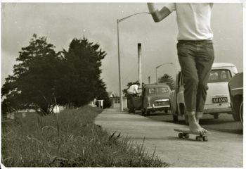 and here's Billy...flying down the hill...doin a 'hang 5' the plaster on his arm was probably from last weeks skating..Ha!!