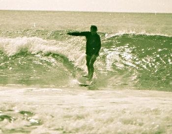 Max ..about to dig a rail...Waipu ...winter of '66 some of us still didn't have a good wetsuit in '65....still using the good ol' woollen Jerseys