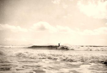 Brett Knight surfing Waipu Cove...summer of '64 this was typical of Bretts style..right arm in the air!!!!....but trimming nicely!.....we pretty well knew everyone that surfed locally in '64...i guess it was the same most everywhere in NZ then!!!..