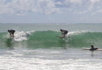 Eddie Aickin and son Sam..practising for the 'Sinc' father and son world champs...Ha!! while daughter Hanani looks on in amazement....Wooleys Bay ...summer of 2014