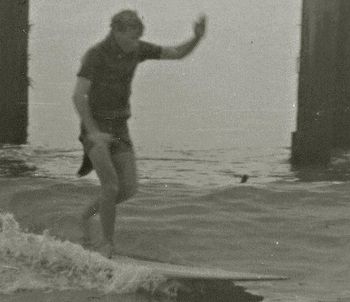 Guess who and where? Well, it's actually Dick Robinson...with one of those old diving wetsuits on with the horrible flap that we used to cut off ...and he's surfing a place called .....................!!! looks soooooo much like Ken Beehre!!!!