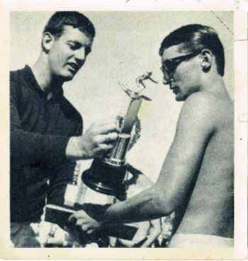 NZ Surf Riders President hands Wayne his 1967 NZ Champs trophy... Wainui Beach Gisborne...summer of '67