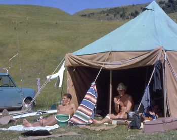 Shipwreck bay 1967....it wasn't called 'Shippies' then...was called Ahipara or Shipwreck bay!! Murray Jack and ......Max Atkins showing us his sore fingers...murrays mini....Bill Durham was there too!!....Camping at Ahipara ...how cool!!