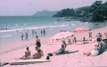Ian and Robin Hills mum and dad with Don and Ross Edge...Waipu..summer of '64 not exactly a very enticing day at Waipu this day...however...we really didn't care then...was just awesome just to be at the beach...Ruakaka was often like this and we just loved it anyway!!..