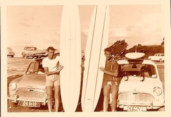 Dicky Robinson and friend ..Waipu Cove 1964 Dick would have been about 17 now and was doing a carpentry apprenticeship with Jack Guy builders...hence the mini and the new board!!