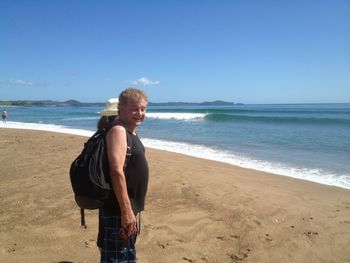 60 yr old Graeme Kelly 'Fry' Graeme & his wife on Pataua Bch on a beautiful 2013 summer morning..warm water..good swell..Graeme has been living at Pataua for years..he just couldnt look at that perfect left this day..left his board at home.(or did he forget it!!!)..dosen't surf now