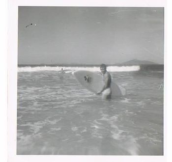 This is a great photo Dosen't this shot look all so virginal and innocent...really captures well the freedom and simple-ness of life back in the late 50s early 60s!!......there was noooo rush....you could have any wave you wanted.......