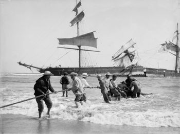 The 'Forest Hall' breaks up from relentless west coast waves ...90 mile beach 1909 Crewmen salvage the leftovers....