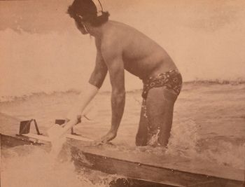 Waipu Cove carnival 1965 One of the Mangawhai Heads boys in the surf ski race...hollow ply surfskis were still around in '65