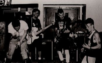 Civil Disobedience live @ the Capitol Theater (in the lobby), Flint, Michigan, May, 1991. Original five member line up, L to R: M. F. Delicious - Vocals, Forbisquis - Bass, Rikkir "The Rougarou" - Rhythm Guitar, Kenny Last Words - Drums, Spanky Lux - Lead Guitar.