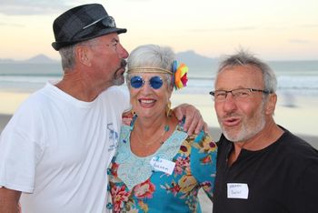 Denis is pretending he's affectionate.....where really he just wants to check the surf out.... Herman cant believe it.....he's touching a girl....