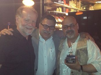Celebrating Michele Ramo's world music award with Howard Herts president of the Detroit Music Awards