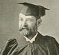 Old photo of man in scholastic robes and mortarboard hat
