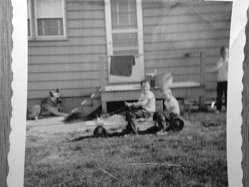 Prince the German Shepard, HarryHarry (driving) and Me The race car was built by my dad. That is my brother Gary and me. (My Life Before)