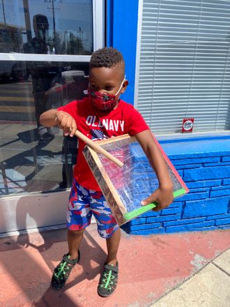 Peace to the young King who couldn't wait to make some rhythms on the drums. Deep East Oakland, MacArthur. Garvey Drums 2021.