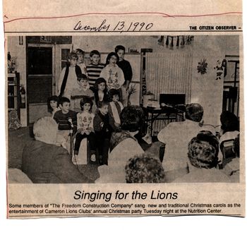 1990_Freedom_Construction_singing_for_the_Lions EK on piano with Freedom Construction kids at the Lion's club.