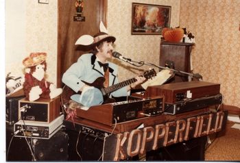 1984_ek doing hat act_must be a rabbit song ek and one man band-3 keyboards-bass pedels-drum machine-Singing and playing guitar
