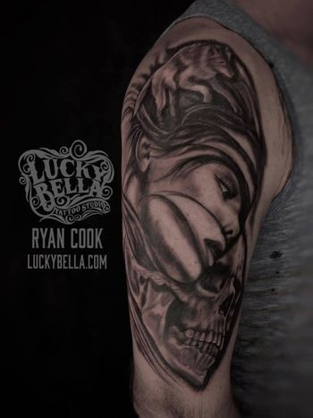 Girl and Skull Face by Ryan Cook at Lucky Bella Tattoos in North Little Rock Arkansas A large black and grey female face with a skull and hidden wolf in the hair by Ryan Cook at Lucky Bella Tattoos in North Little Rock Arkansas