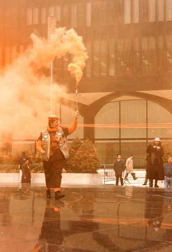 City Shaman (Mama) Danna Henes announcing the upcoming moment of spring equinox at the WTC Photo: Carmela Tal Baron 1991 NYC