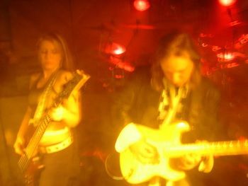 Beauty and the bass!Doing a live show with fellow Michigan rockers Vader's Mistress. Sharing the stage with me is vocalist/5-string bass goddess Kerry Jump.