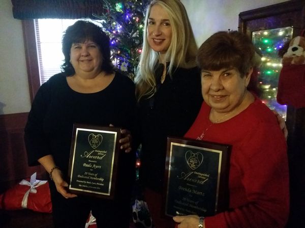 Club Vice President Susan Bess presents the club's very first 20 year membership plaques to Paula Ayers & Brenda Martz