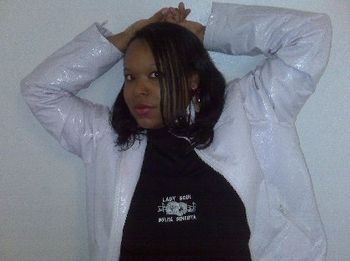 MS. CRYSTAL wearing 2010 Black LADY SOUL with white SOUL-FULL logo. Also wearing white leather jacket over it and black & white Nike Air Force One tennis shoes.