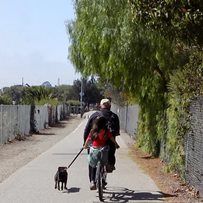 FATHER/DAUGHTER BIKE RIDING WITH DOG