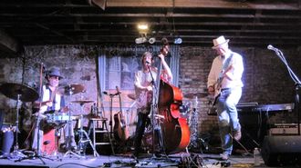 Bella Counsel Trio~ Randall Coyne, Susan, Bella, Bob French. Photo by Hank Woji. WoodyFest
