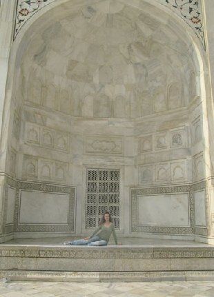Bethany is shown dwarfed here by one of many ornate all marble alcoves that are cut out of the exterior walls of the Taj Mahal. (Photo by Jim Whirlow 2007)